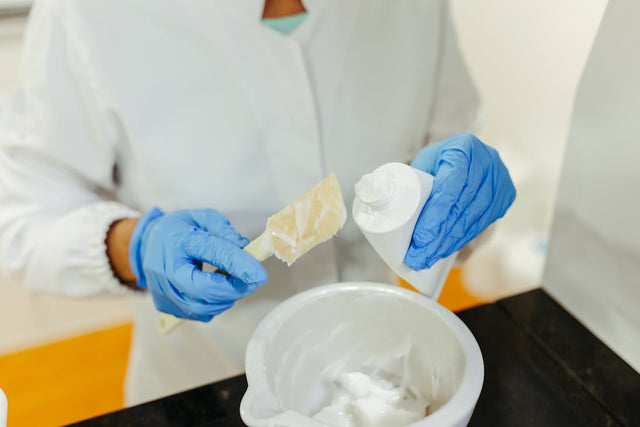 Lab tech mixing skincare cream