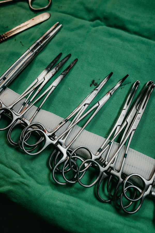 Surgical tools on green cloth