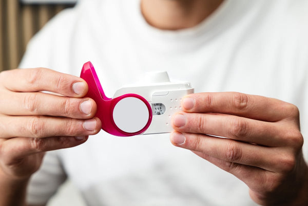 Hands holding peak flow respiratory meter