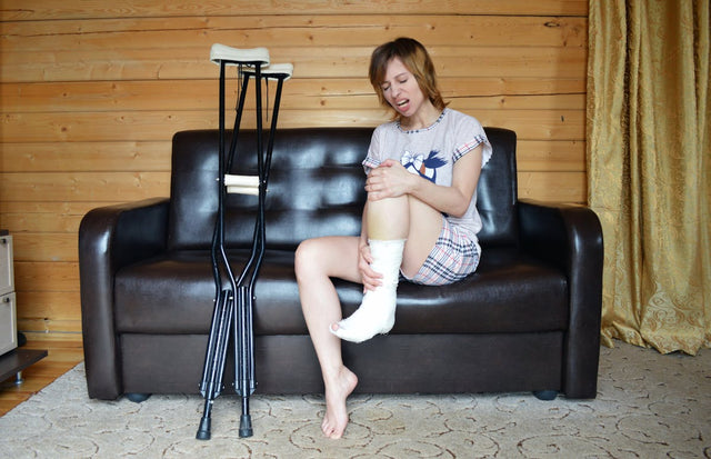 Woman with cast and crutches