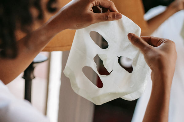 Woman with sheet mask