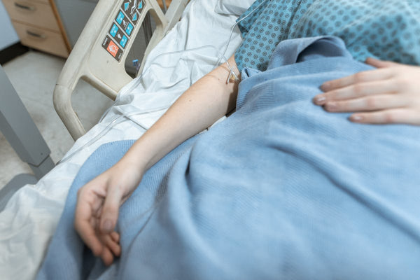 Patient with hospital blanket