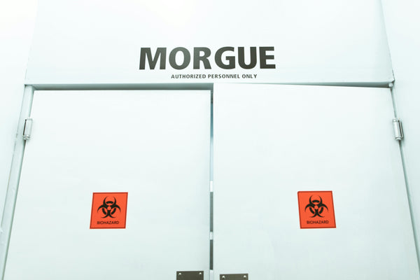 Morgue entrance with biohazard warnings