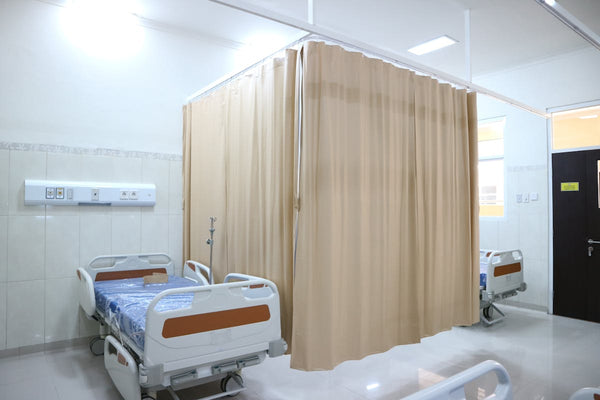 Hospital ward with privacy curtains