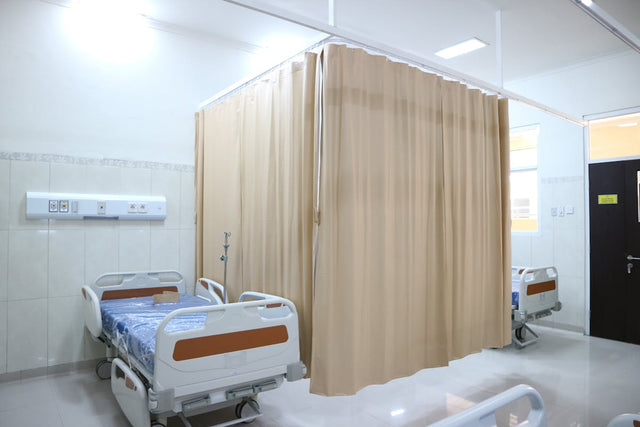 Hospital ward with privacy curtains