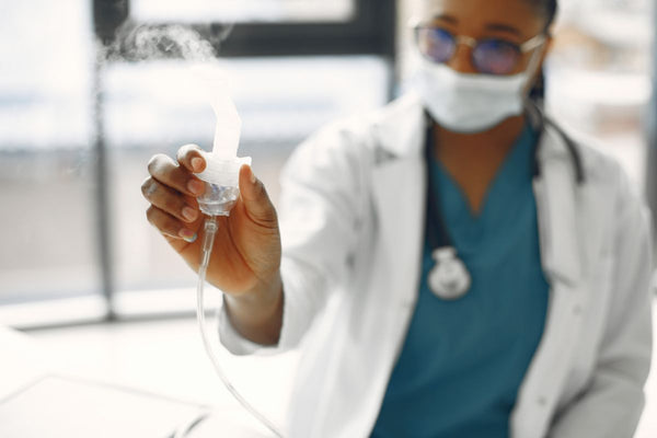 Healthcare worker with nebulizer