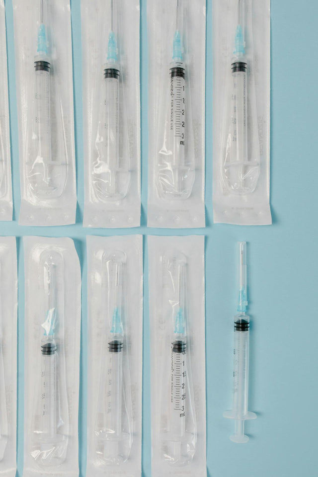 Sterile disposable syringes flat lay